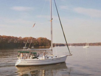 ComPac 35 motoring in calm water - Photo of Com-Pac 35 sail boat